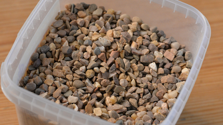 Chicken grit stored in a white tub