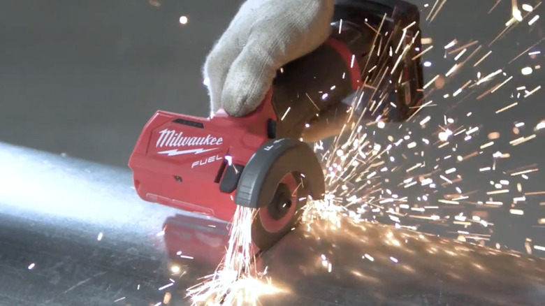 Milwaukee's M12 Lithium-Ion Brushless Cordless Cut Off Saw in action with sparks flying
