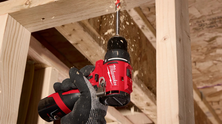 Milwaukee's M12 Lithium-Ion Brushless Cordless Subcompact Drill Driver being used on wood framing