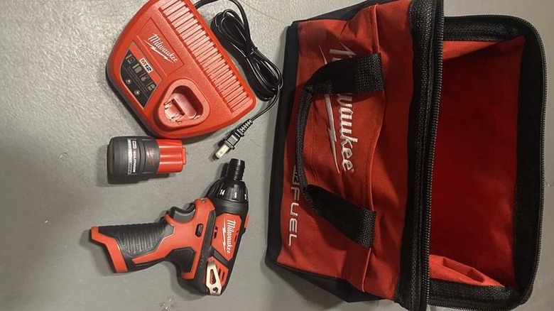Milwaukee's M12 Lithium-Ion Cordless ¼-inch Hex Screwdriver Kit on a surface