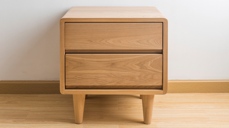 Closeup of a pine table with two drawers