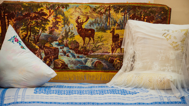 Vintage woodland tapestry hanging on a wall
