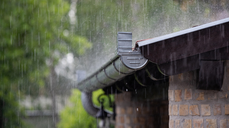 Heavy rainfall on house's gutter