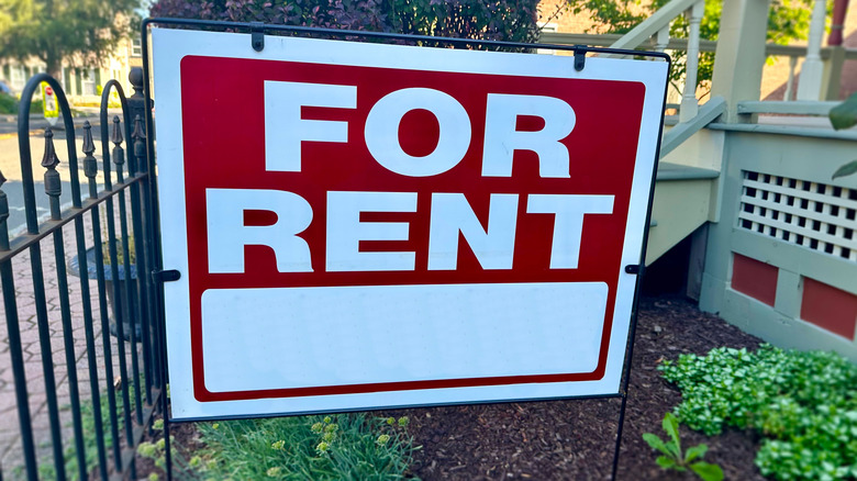 A for rent sign in front of a home.
