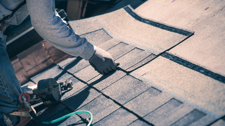 A worker fixing a service line.