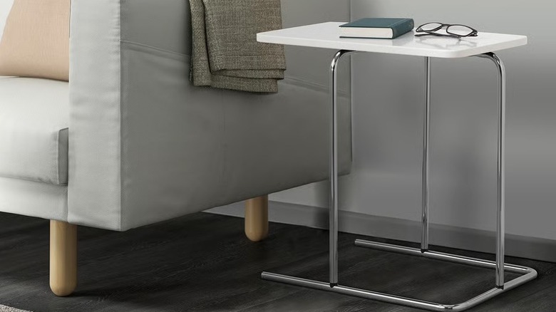 A close up on a modern white side table.