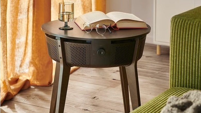 A retro style side table with an air purifier.