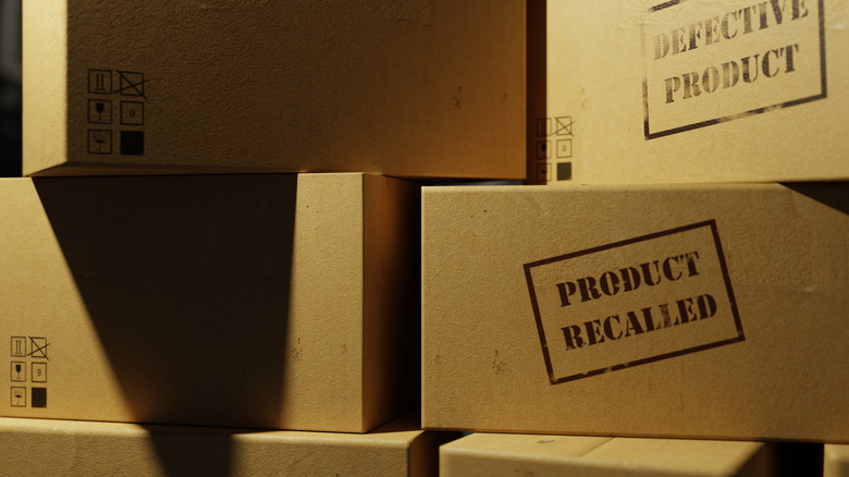 Boxes labeled defective product or product recalled