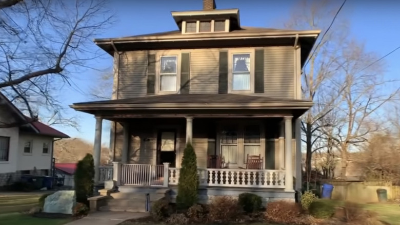 Gray American Foursquare with green shutters