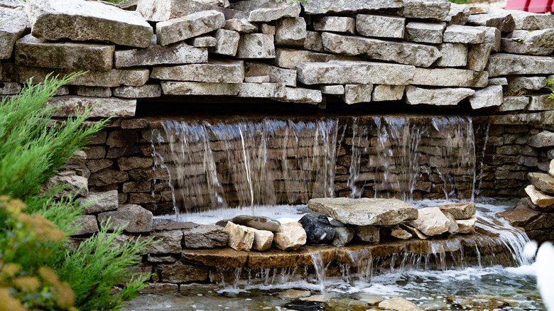 A large backyard stone waterfall