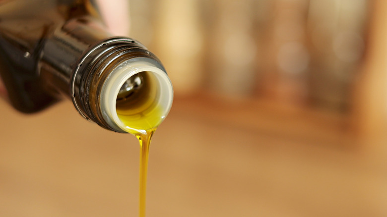 olive oil pouring from the bottle
