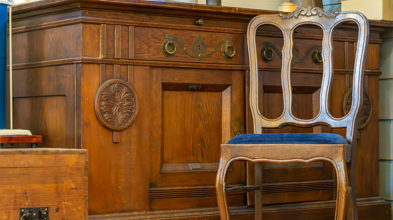 vintage wooden sideboard and chair
