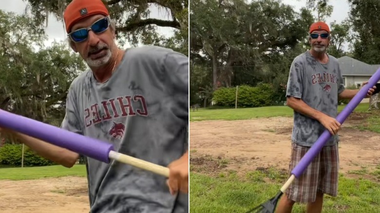 Man using a garden tool with a pool noodle over the handle