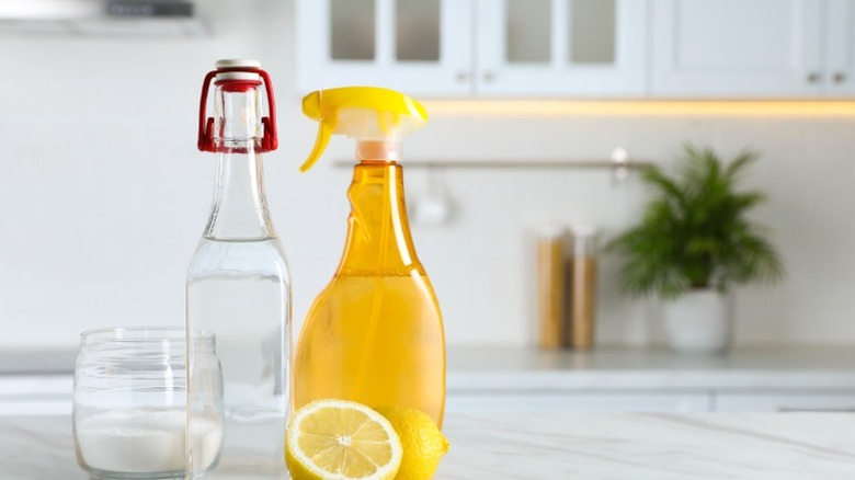 Cleaning supplies including lemons and spray