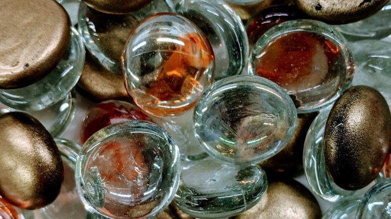 Floral glass gems in a pile.