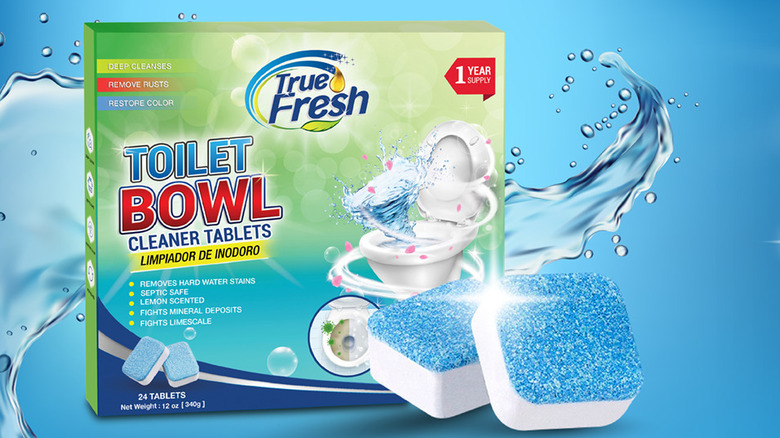 A woman about to use a True Fresh cleaner tablet