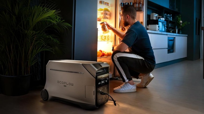 EF Ecoflow Delta Pro 3 in front of man looking in fridge
