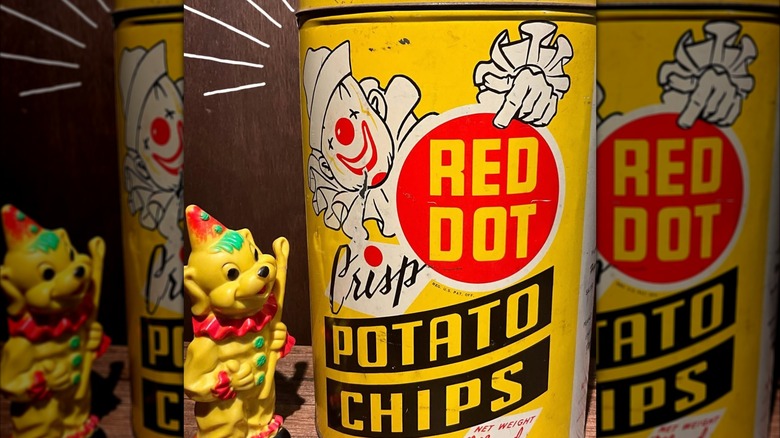 vintage yellow red dot potato can next to clown toy