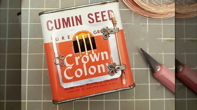 vintage cumin seed spice tin on crafting table