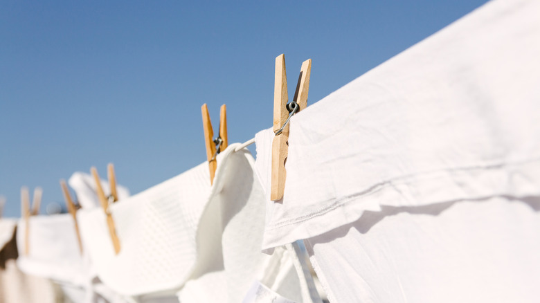 White clothes drying on a clothing line outside