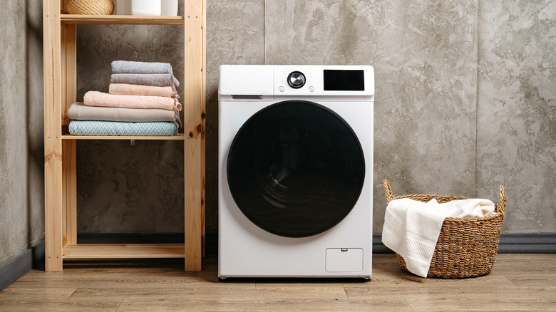 A washing machine in a laundry room