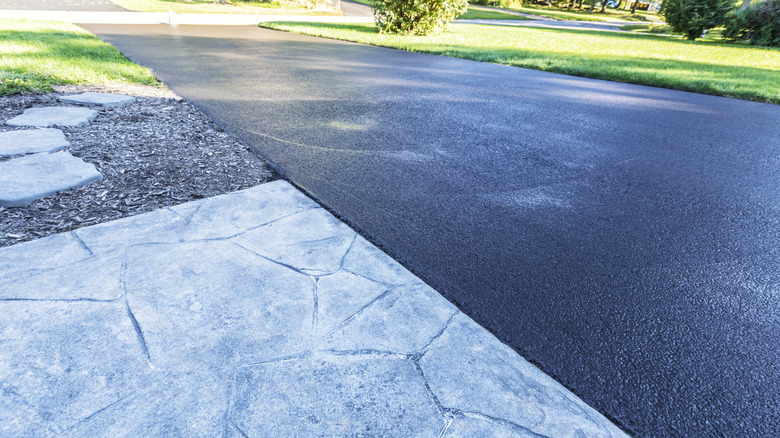 View of asphalt driveway from the side