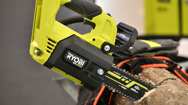 Ryobi saw cutting through a log