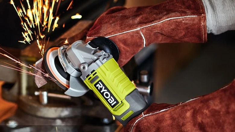 Person using a Ryobi grinder