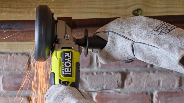 Person using a Ryobi angle grinder