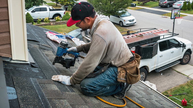 Roofer installing new roof