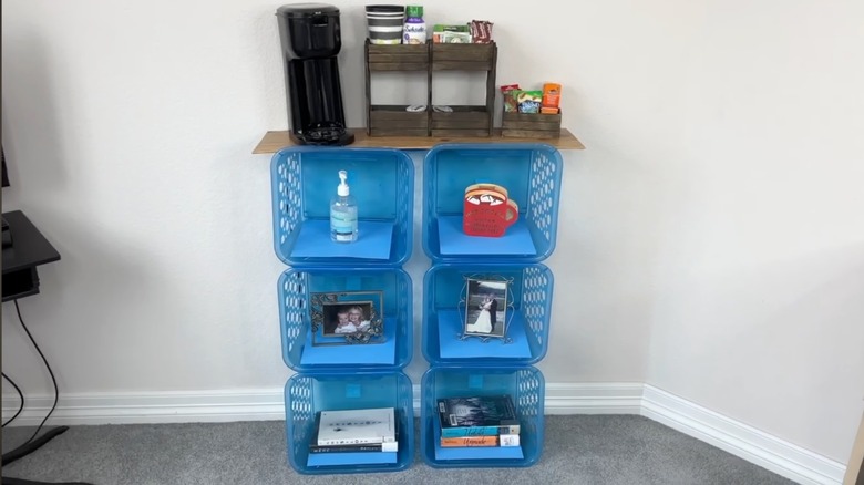 A homemade accent cabinet using stacked Dollar Tree baskets and a faux wood table top coffee station.