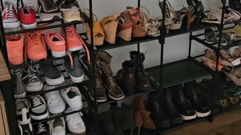 Large metal shoe rack in a garage