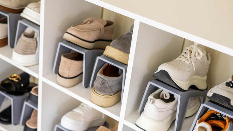 Shelf with shoes on plastic organizers