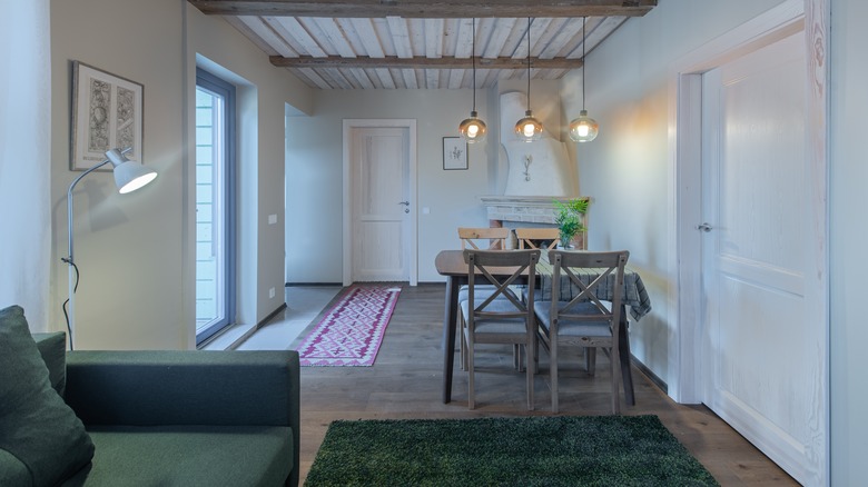 Pendant lights over the eating area in an open floor apartment