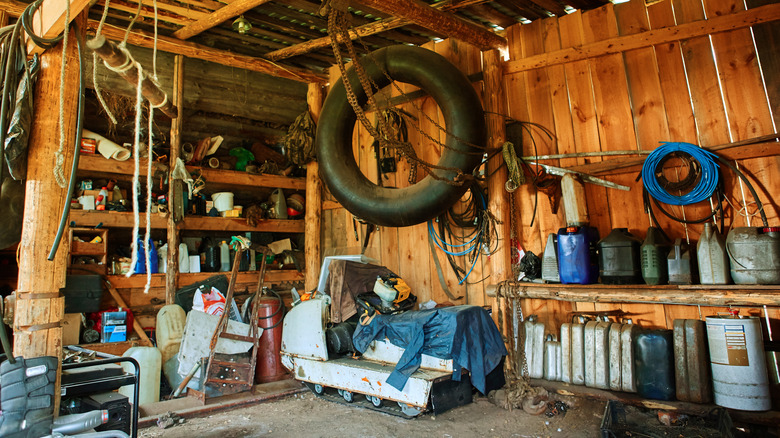 An old shed with heavy items on the floor