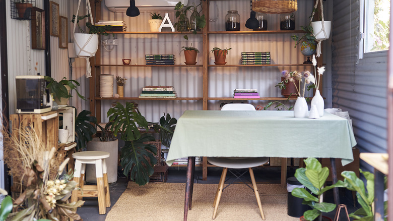 A beautiful shed interior with lighting plus windows that allow daylight to spill inside