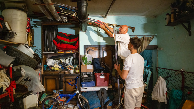 Two people decluttering a garage