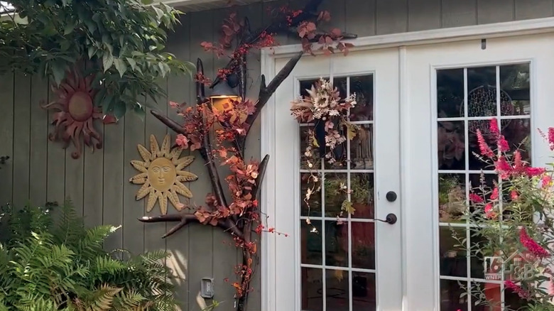 A faux fall wood archway created with pool noodles