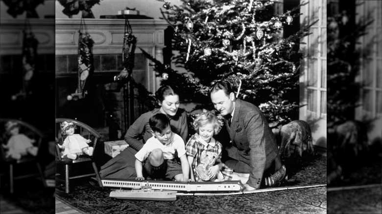 A family in the 1930s in front of their Christmas tree
