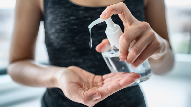 A woman applying rubbing alcohol 