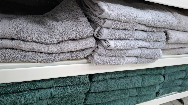 stacks of folded towels on shelves