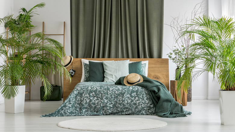 Bed with drapes behind it