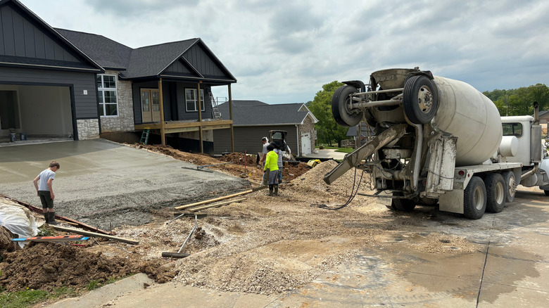 Ready mix truck pouring a concrete driveway
