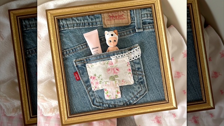 Jean pocket with lipgloss and vintage Sonny angel inside a frame