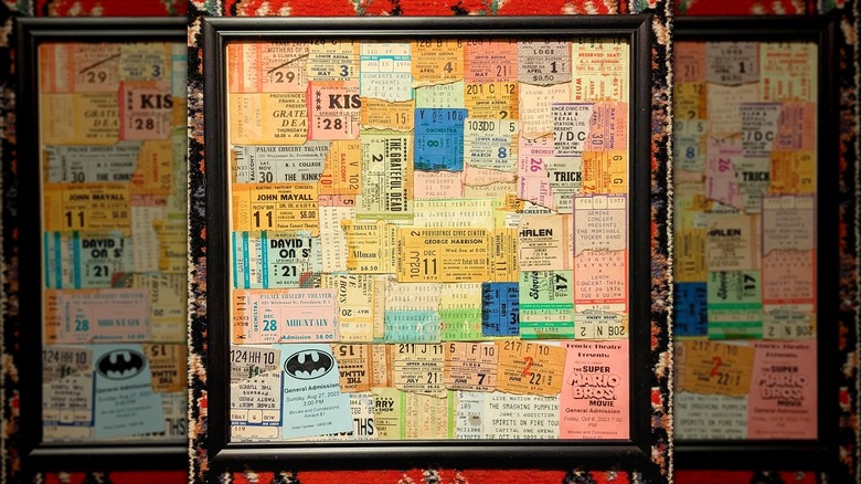 Concert ticket stubs in a black frame
