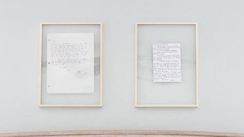 Handwritten letters framed on a wall