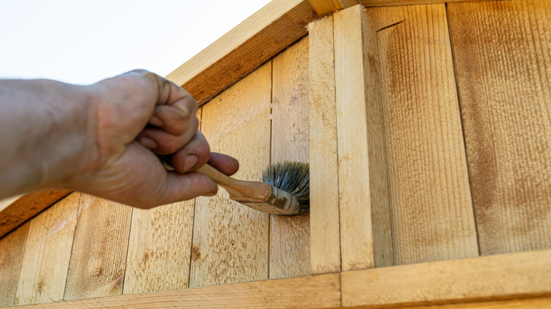 Varnishing a wood fence