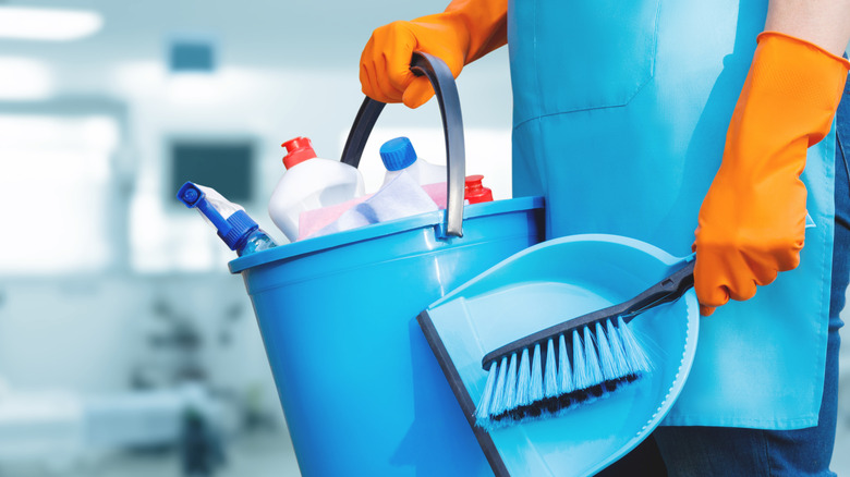 A bucket of household cleaning products