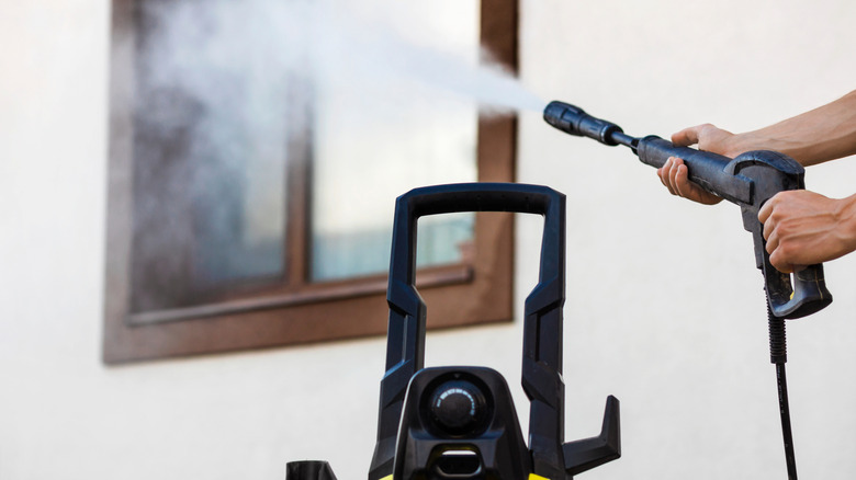 Pressure washing a window
