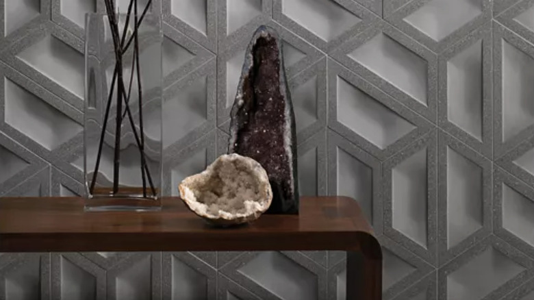 Andy Fleishman's Couplet Hex tiles for Ann Sacks in blue/gray on a wall